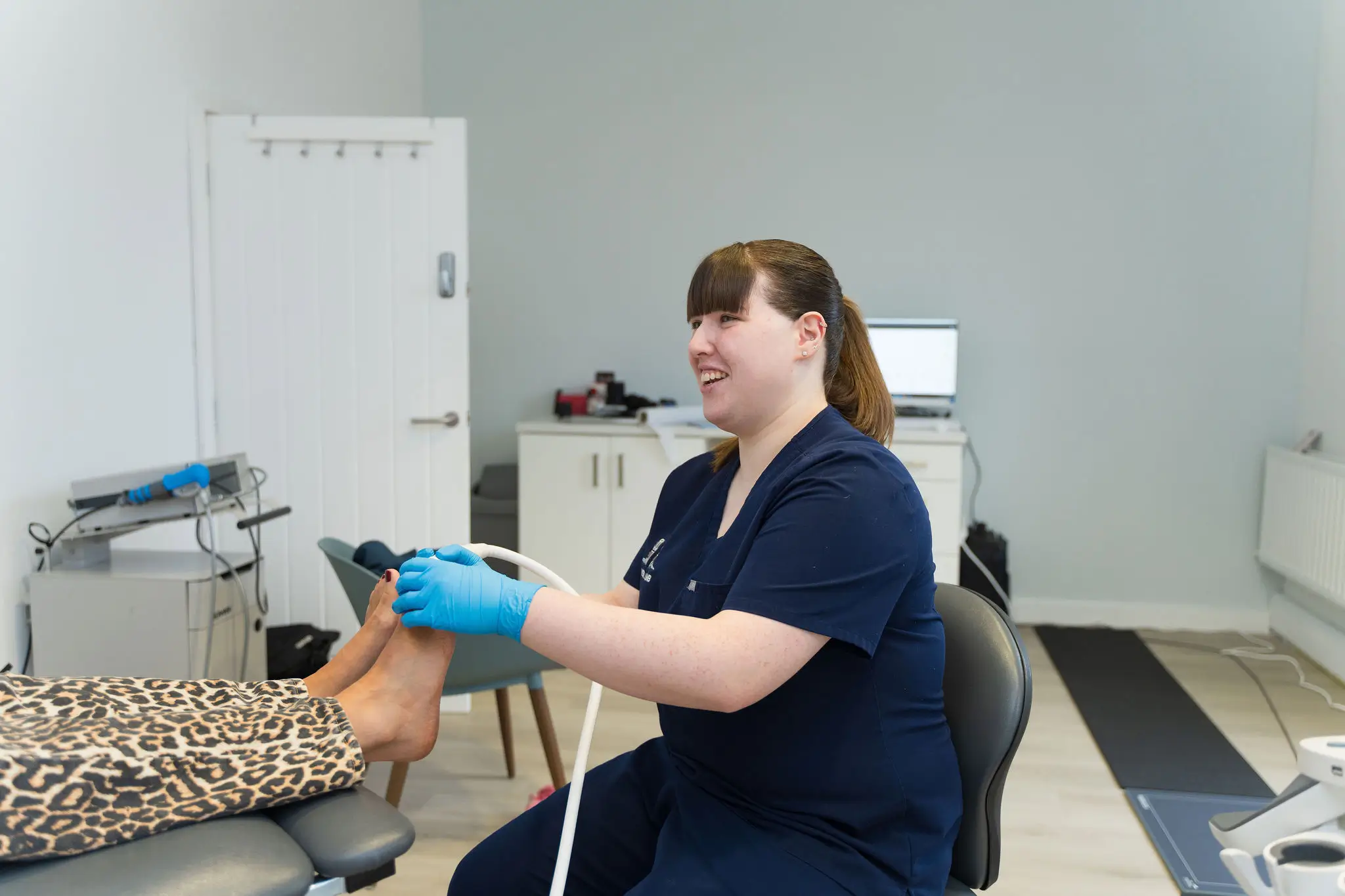 Specialist podiatrist assessing the cause of a patient's heel pain